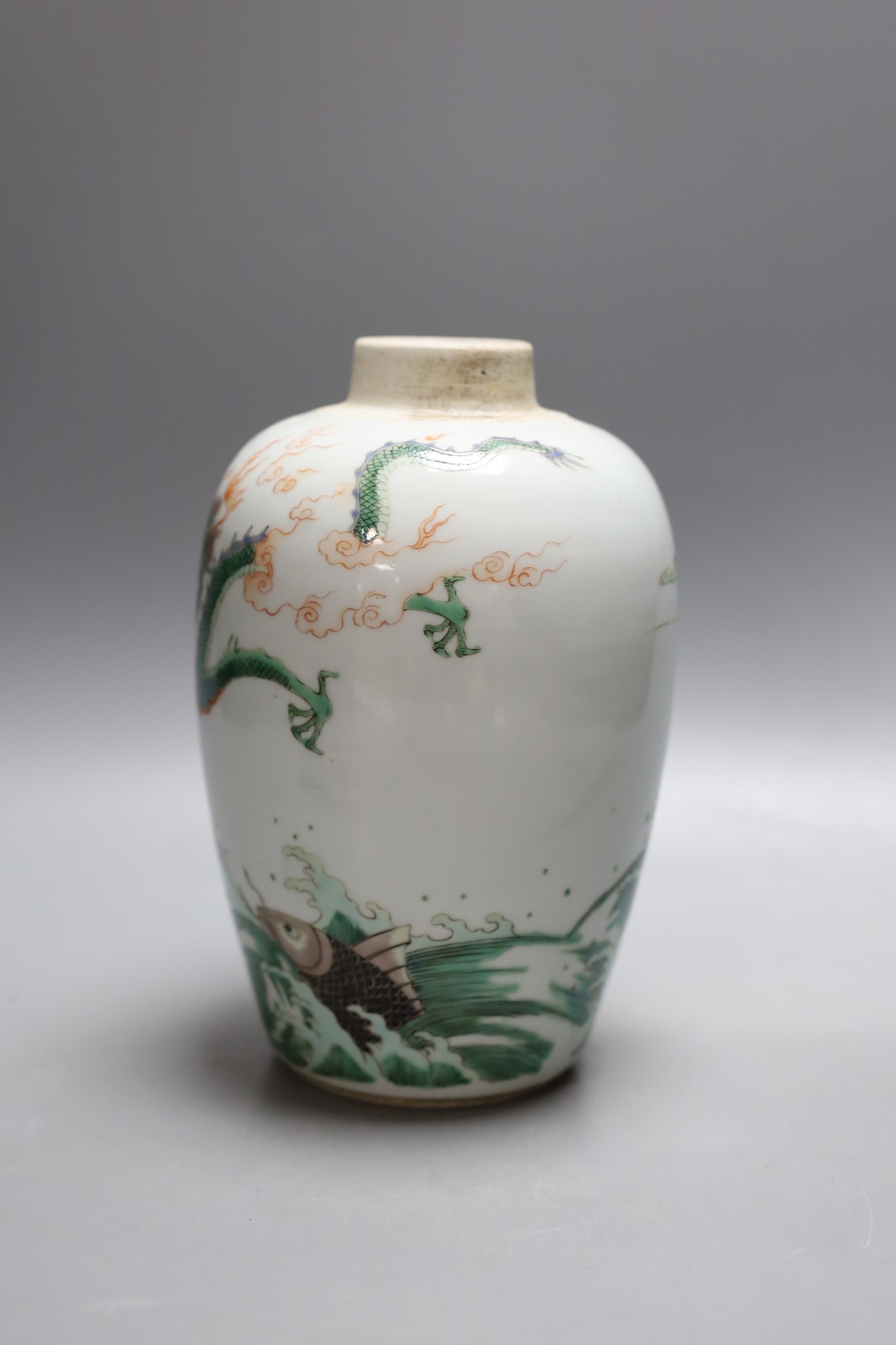 A Chinese famille verte ‘fish and dragon’ jar, lacking cover, 19cm